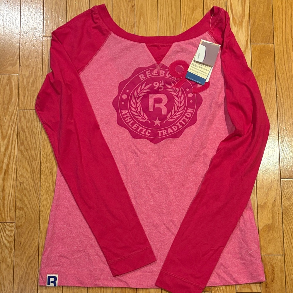 Reebok Women's Two-Tone Pink Long Sleeve Logo Top wide neck off shoulder design